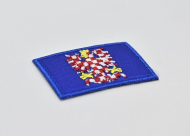 Rukávová nášivka - Moravská vlajka s orlicí, motiv moravské orlice vyšitý na modrém podkladovém materiálu.